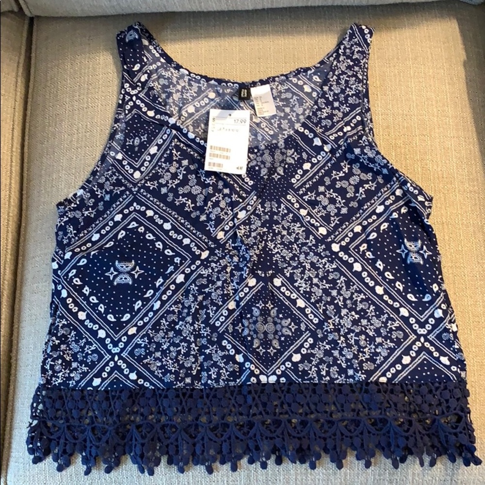 Navy blue and white sleeveless shirt